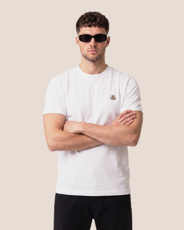 Moncler bela z okroglo značko